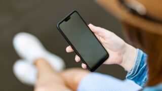 person holding black smartphone